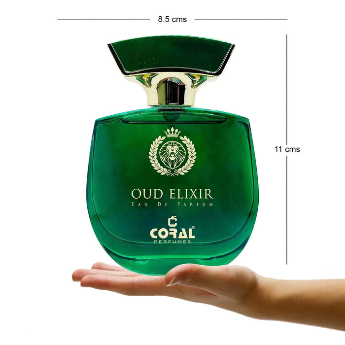 Green perfume bottle labeled 'Oud Elixir' held in a hand with measurements on a white background