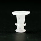 Close-up of a glow in the dark Puffco glass joystick cap