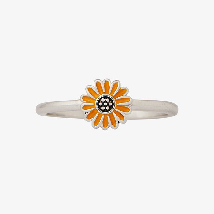 Silver band ring featuring a bright orange enamel sunflower on a white background