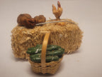 Haybale with Chicken and Cucumbers in Woven Basket