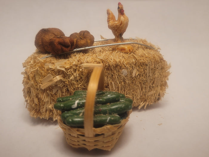 Haybale with Chicken and Cucumbers in Woven Basket