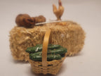 Haybale with Chicken and Cucumbers in Woven Basket