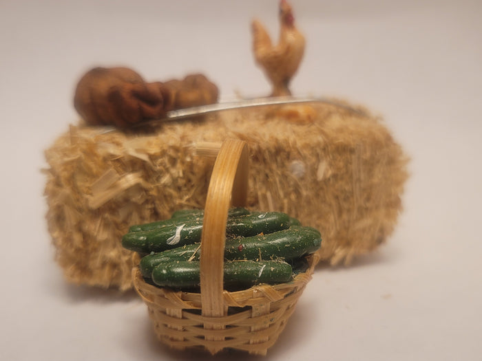 Haybale with Chicken and Cucumbers in Woven Basket