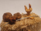 Haybale with Chicken and Cucumbers in Woven Basket