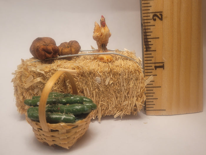 Haybale with Chicken and Cucumbers in Woven Basket