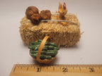 Haybale with Chicken and Cucumbers in Woven Basket