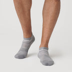 Heather Gray Ankle Socks 12-Pack on feet, showcasing seamless toe design.