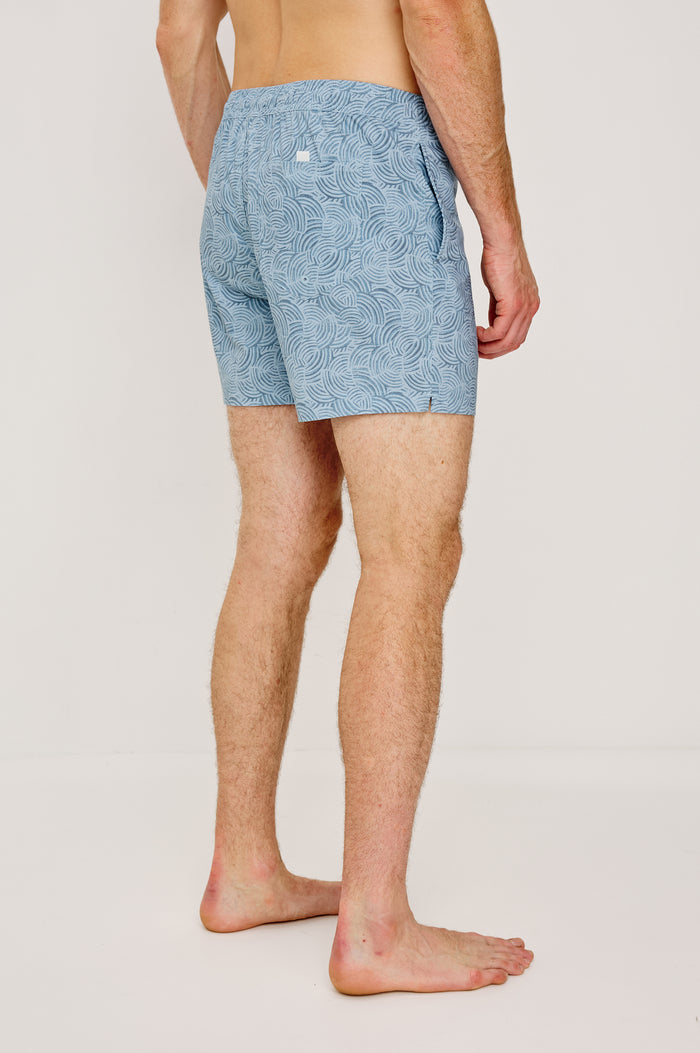 La Brea Mid-Length Swim Shorts With Adjustable Waist Drawstring Ties and Side Pockets in Conch Blue Colorway - Lower Body Back View Featured on Model