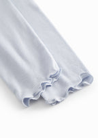 Light blue leggings for children with fine lace details at the bottom.