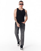 Martin Valen men's faded black straight-leg jeans, front mid-body view showing raw hem and visible drawcord