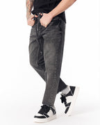 Martin Valen men's faded black straight-leg jeans, full-leg view highlighting frayed raw hem and straight silhouette