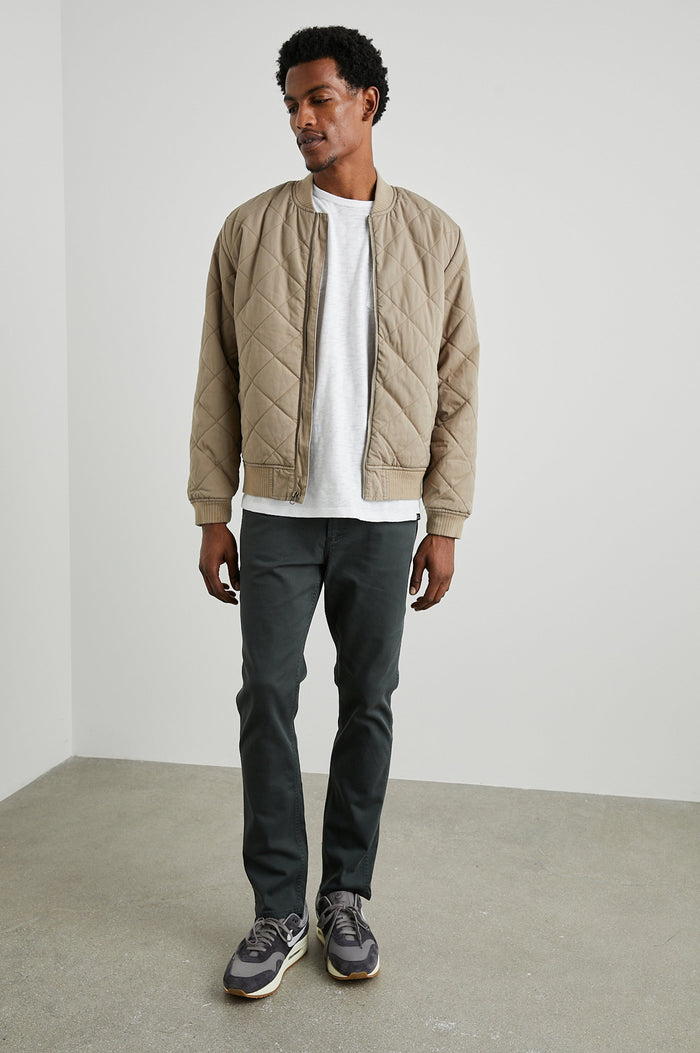Peninsula Jacket with Zip Closure, Two Front Pockets, an Inner Zippered Pocket, a Quilted Pattern and Ribbed Trim in Vintage Khaki Colorway - Front Full Body View Featured on Model