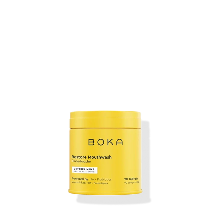 Yellow container of Boka Restore Mouthwash on a white background