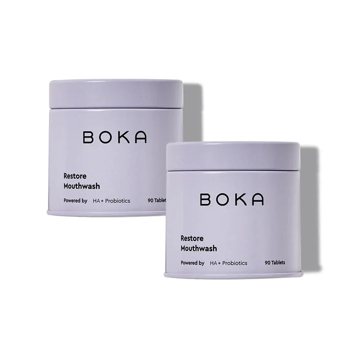 Two containers of Boka Restore Mouthwash on a white background