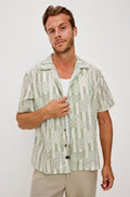 Rhodes Boxy Button-Up Shirt in Crepe With Back Box Pleat, Vintage-Inspired Notched Collar, Front Buttons, and Short Sleeves in Patchwork Stripe Sage Colorway - Upper Body Front View Featured on Model