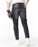 Martin Valen washed black slim-fit jeans rear view with back pockets and bandana on wrist