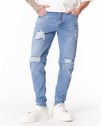 Martin Valen ripped slim-fit jeans in washed blue, front mid-thigh view showing distressed knee rips