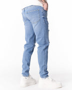 Martin Valen ripped slim-fit jeans in washed blue, centered front view showing multiple distressed tears and frayed hems